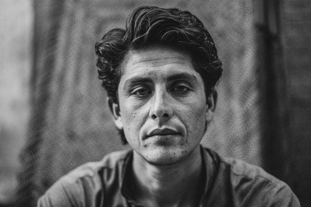 black and white man looking at camera for portrait